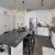 a kitchen with white cabinets