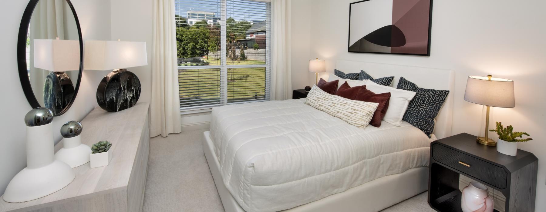 a bedroom with a large window