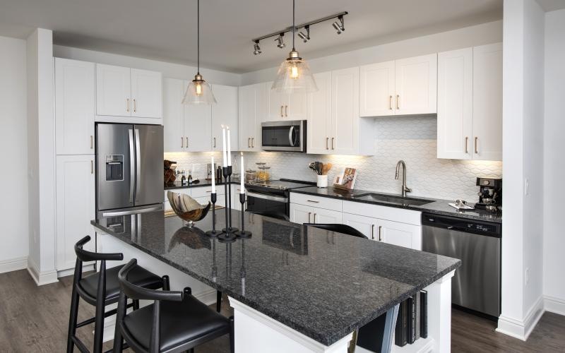 a kitchen with white cabinets