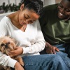 a couple and a dog indoors