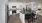 a kitchen with a bar and a dining table
